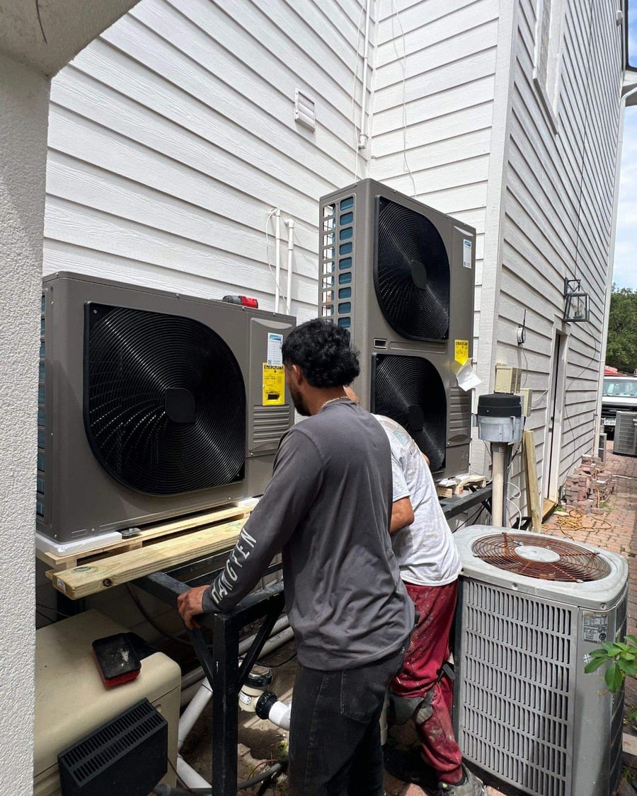 ColdSolutions technician working beside two new outdoor units