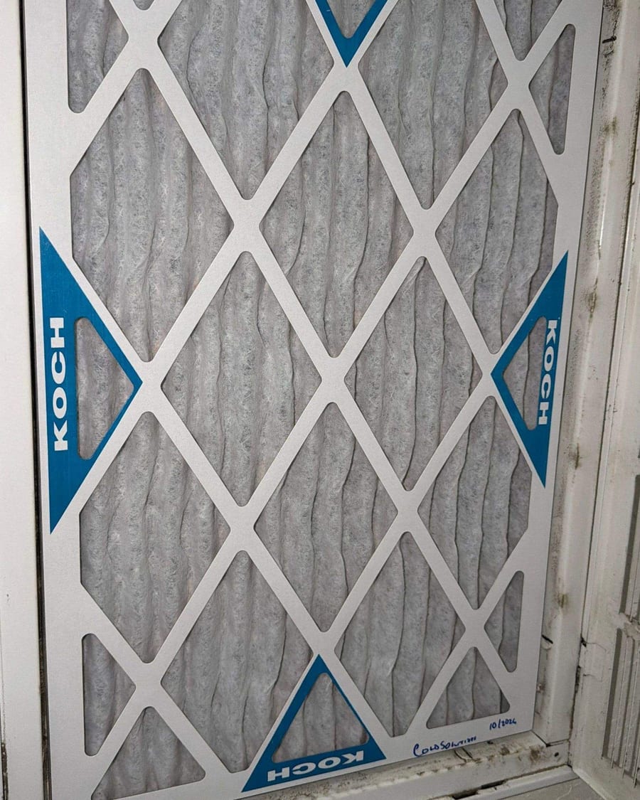 New pleated filter fitted in a return air grille