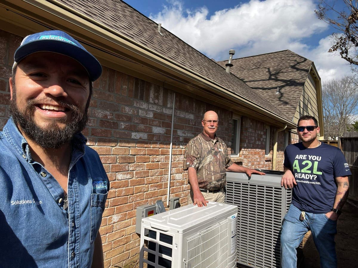 The ColdSolutions crew beside a finished ductless install