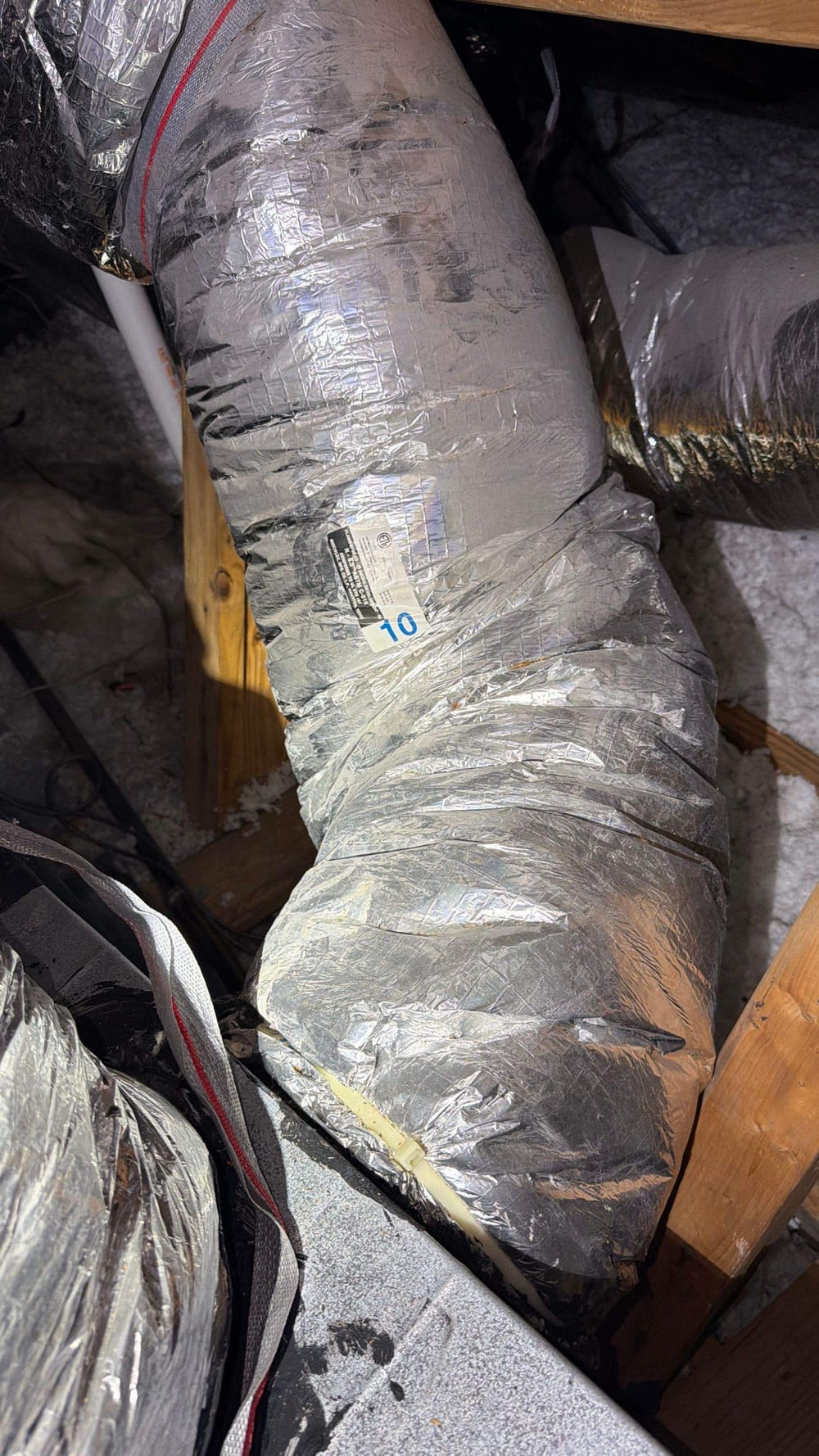 Insulated duct trunk lines in an attic serviced by ColdSolutions