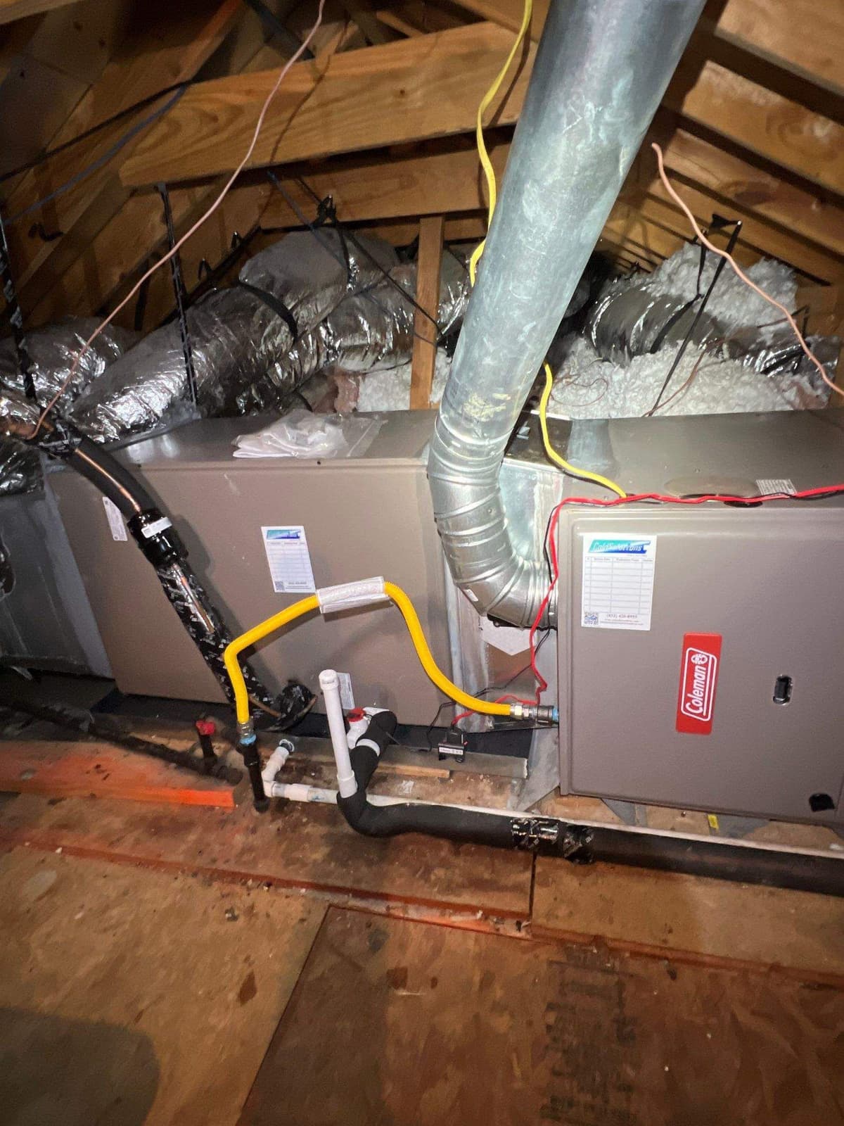 New attic furnace with its gas line, flue pipe and supply plenum