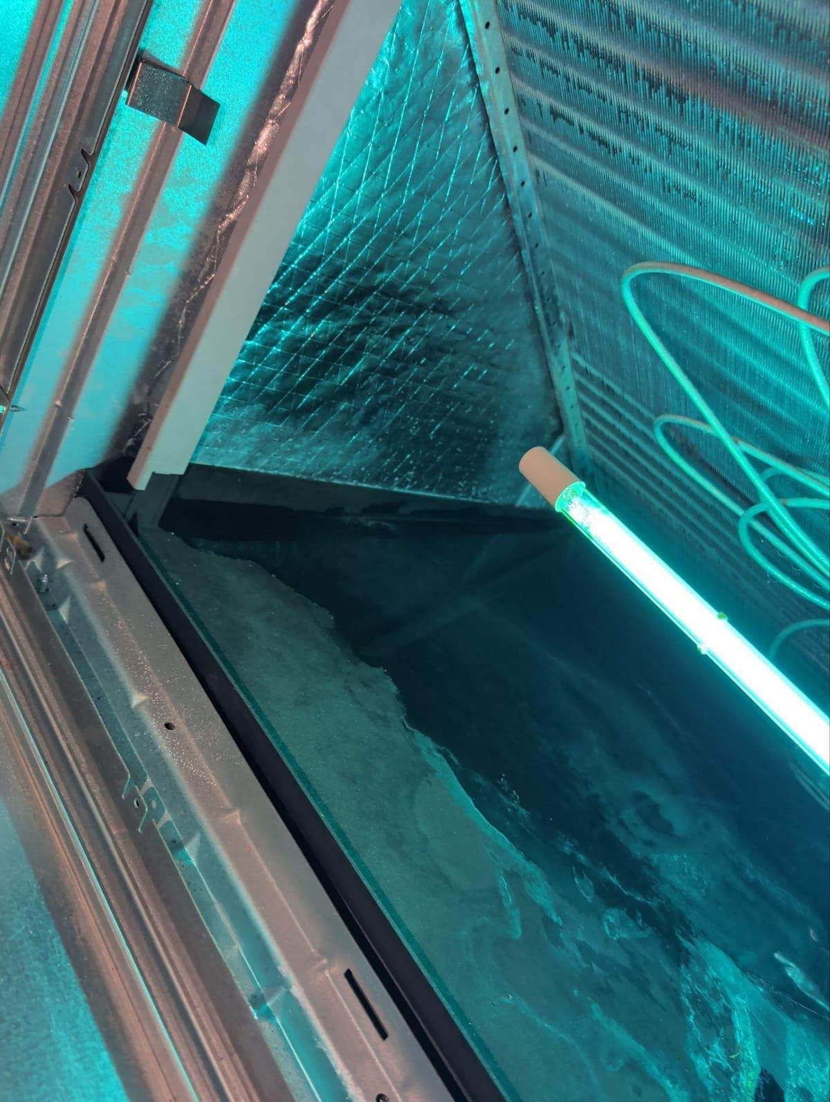 UV light glowing across an indoor coil