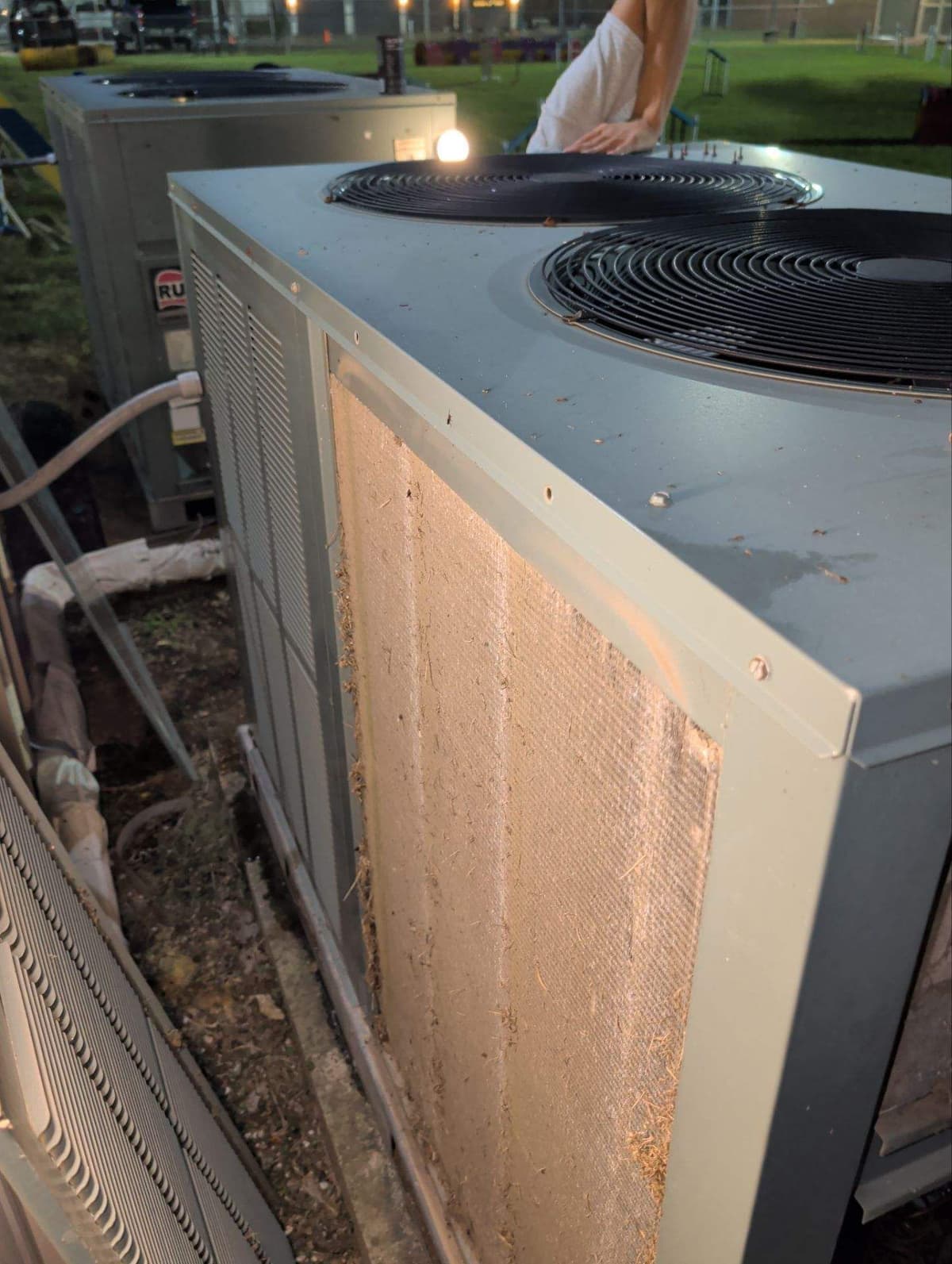 Package unit with its condenser coil in view during a service call