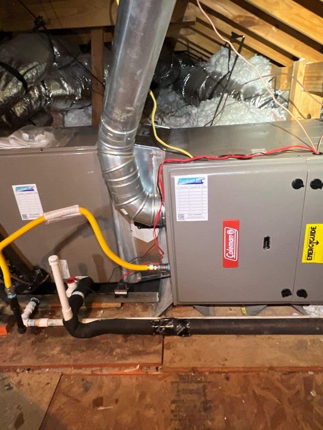 Attic furnace with its gas line and flue piping in place