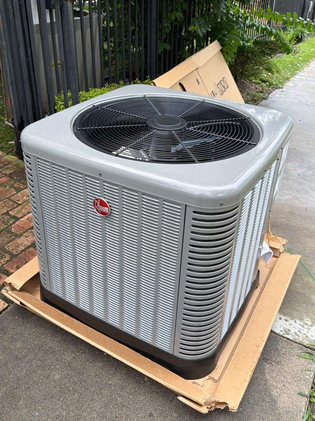 New Rheem condenser on its shipping pallet before install